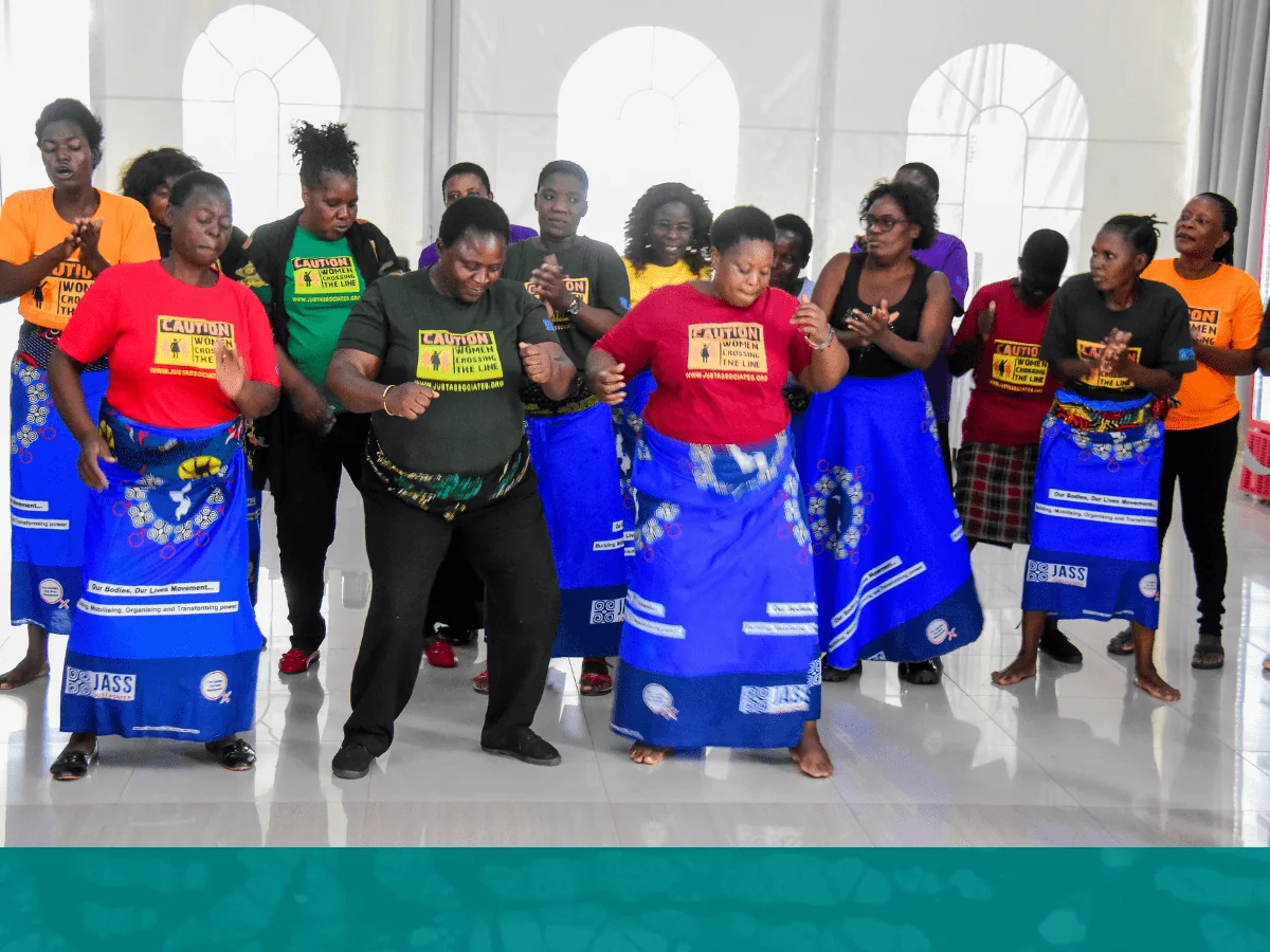 Women gathered together at a JASS feminist popular education dialogue